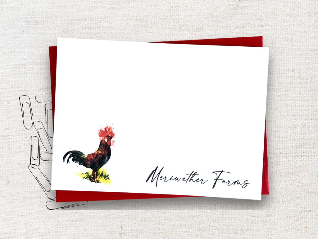 flat notecard with red envelopes and a rooster printed on it
